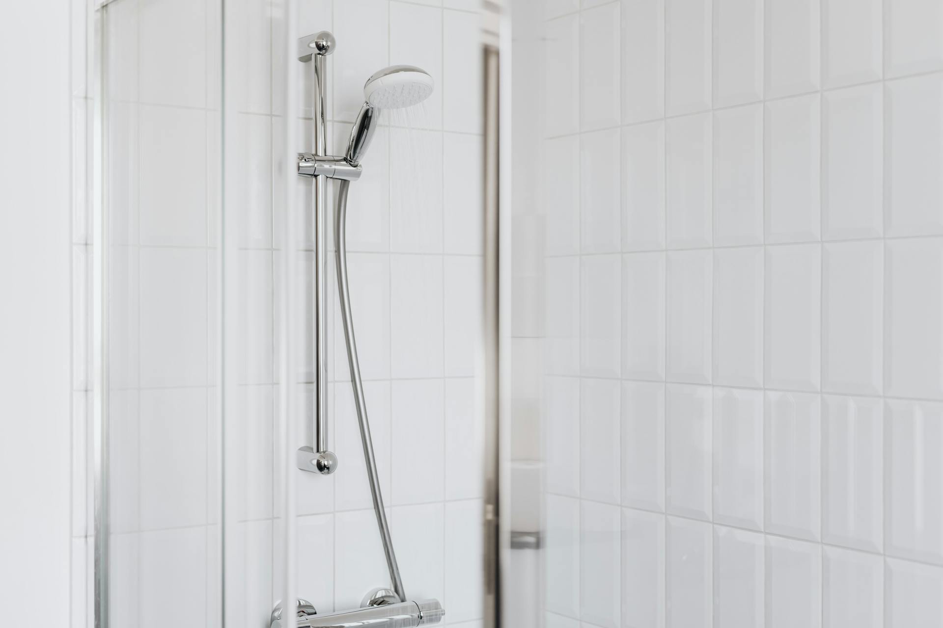 Modern Sydney bathroom shower with clean tiled walls and chrome fixtures after leak repair